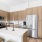a kitchen with wooden cabinets