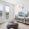 a living room with a couch, a coffee table and a tv