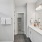 a bathroom with a shower unit and sink