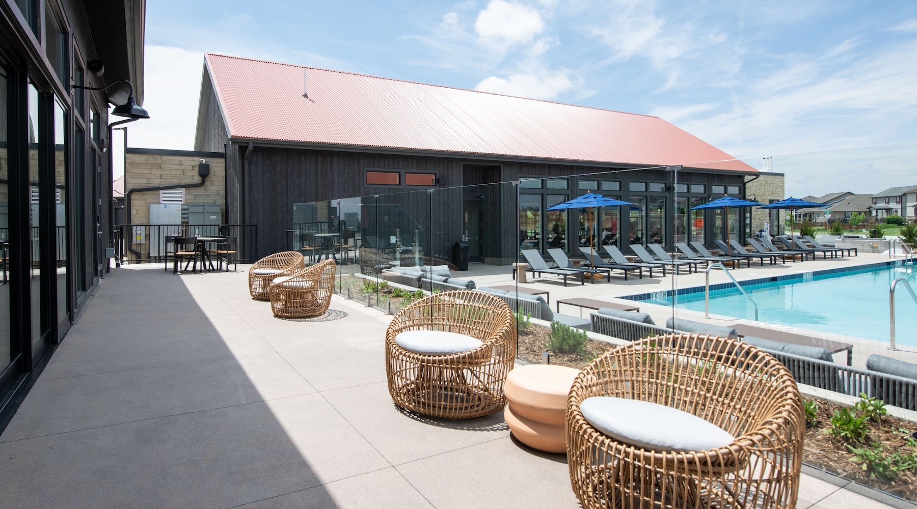 State-of-the-art amenities a pool with chairs all around it