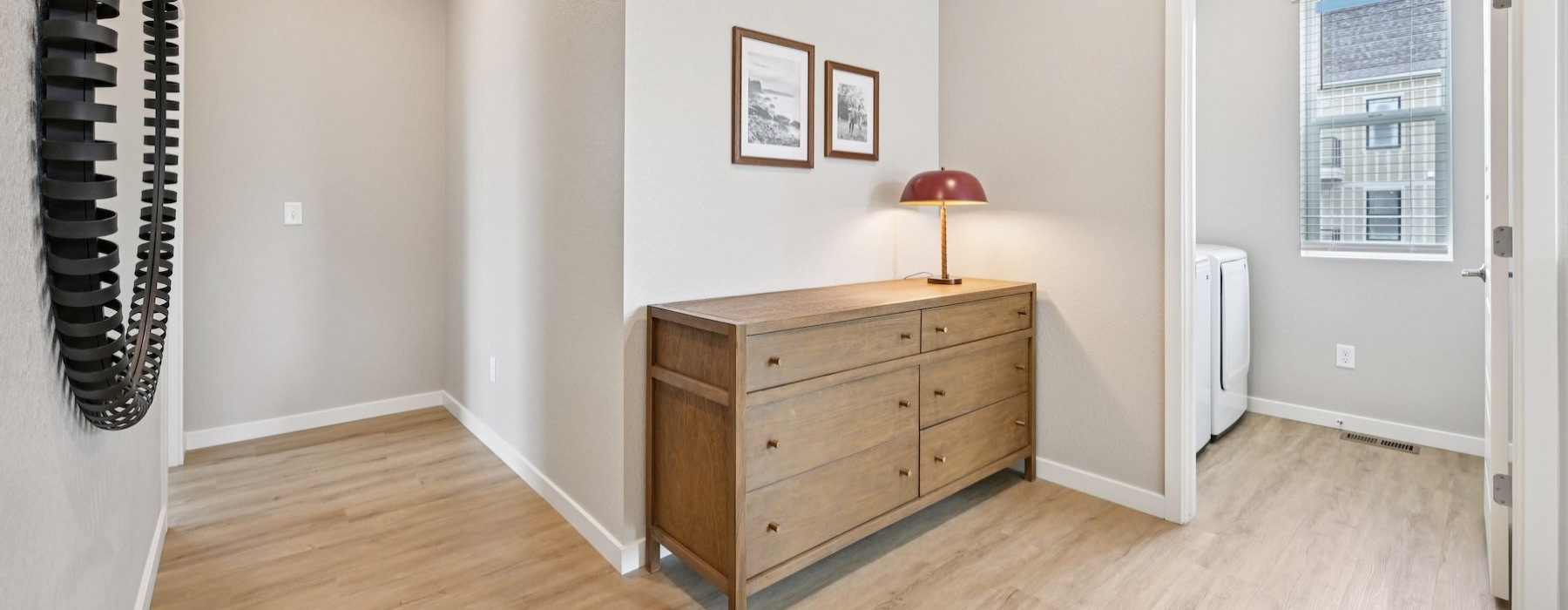 a hallway with a laundry room