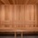 a steam room with wooden walls and a wooden bench