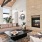 a clubroom with a fireplace, couches and a table