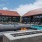a pool in a courtyard with a fire pit and a couch
